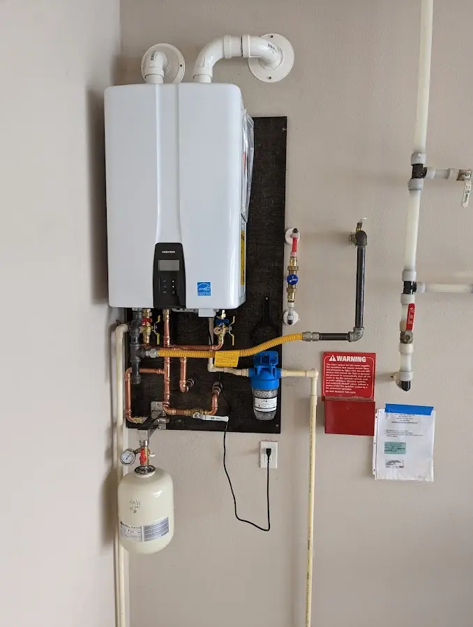 Professional plumber installing copper piping in a Citrus Park home